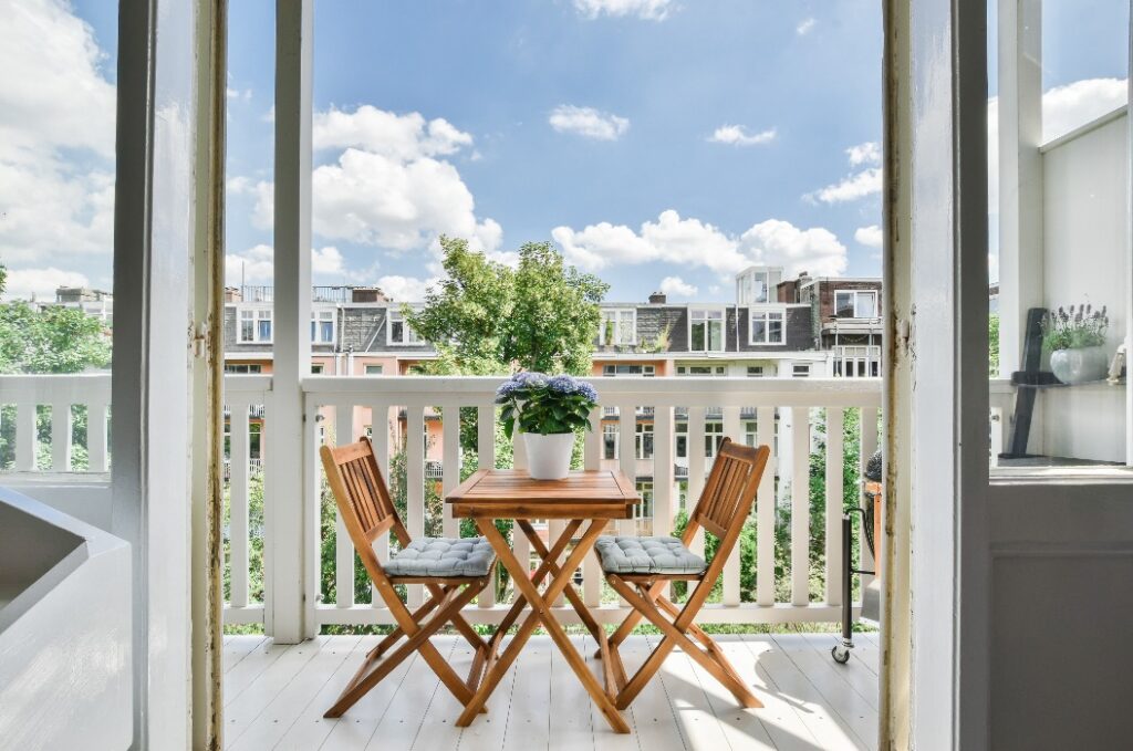 Gorgeous view of the street from balcony with a tea table